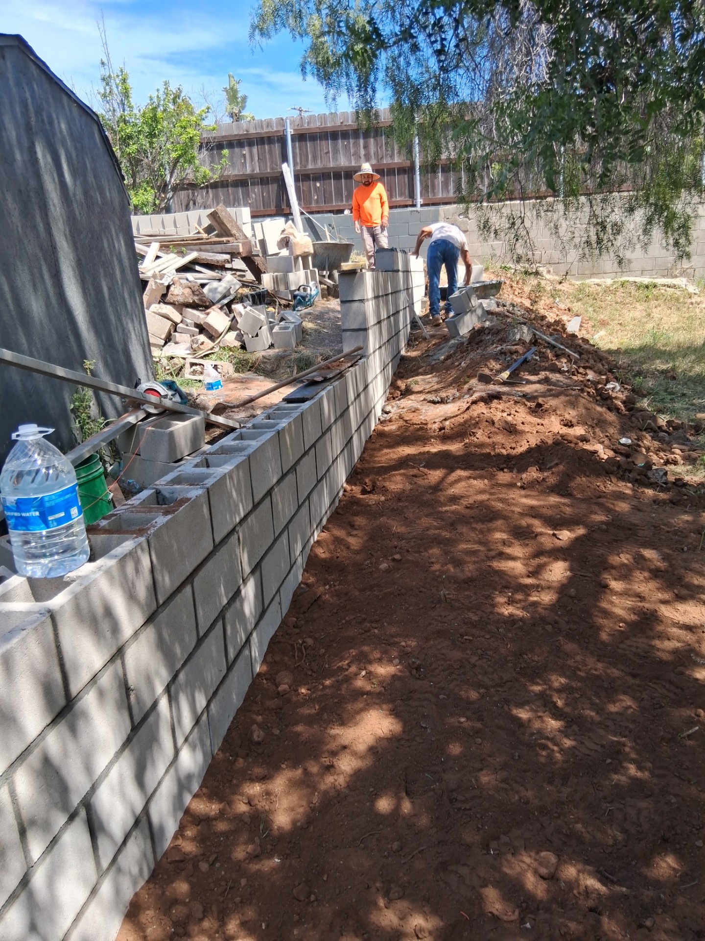 Cinder block retaining wall under construction