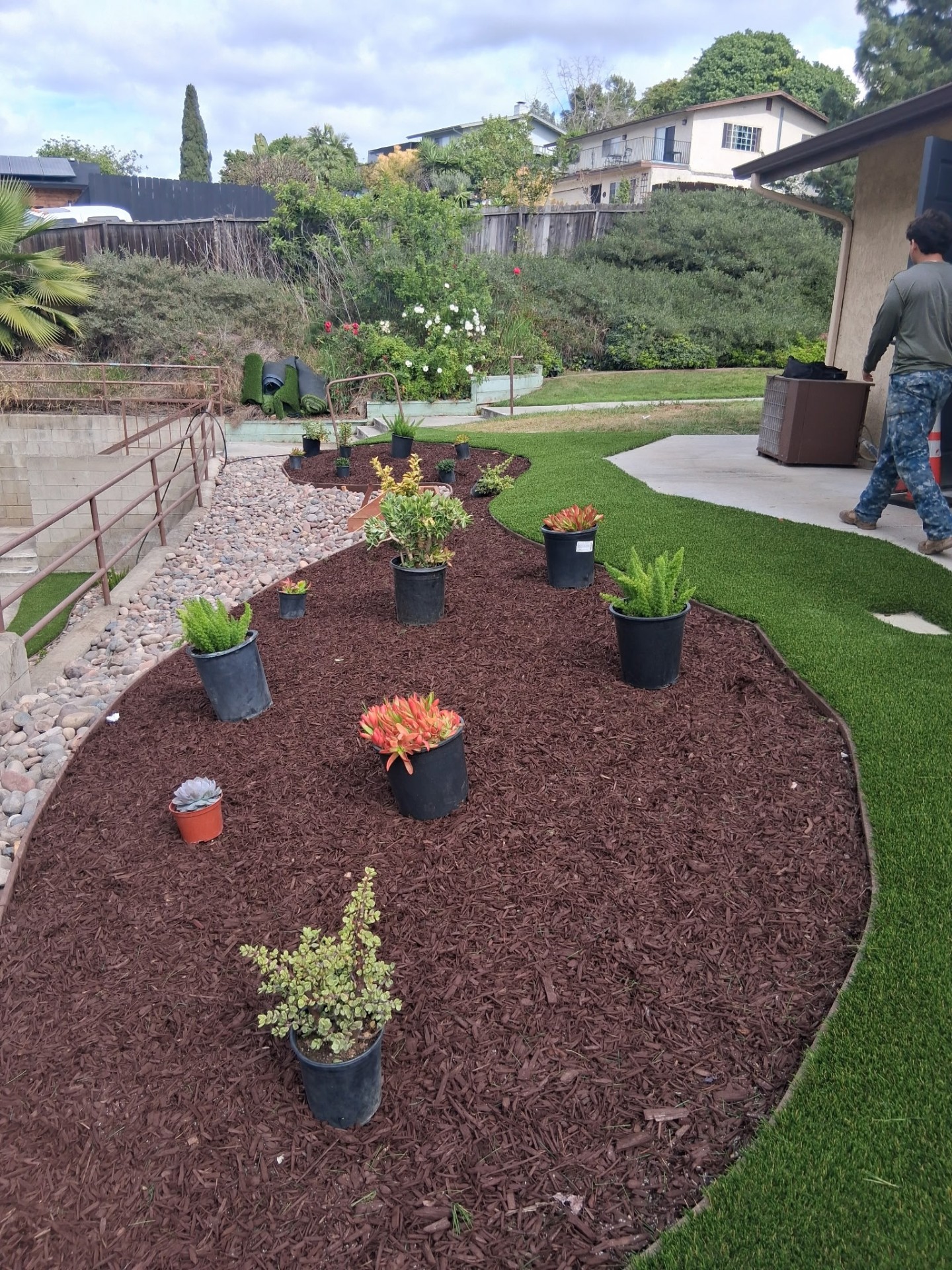 Fresh mulch bed, plant install and artificial turf in a San Diego yard